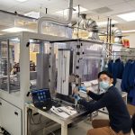 Gyuho Song (’20),Ph.D., adjusting a grip for the mechanical test of materials.